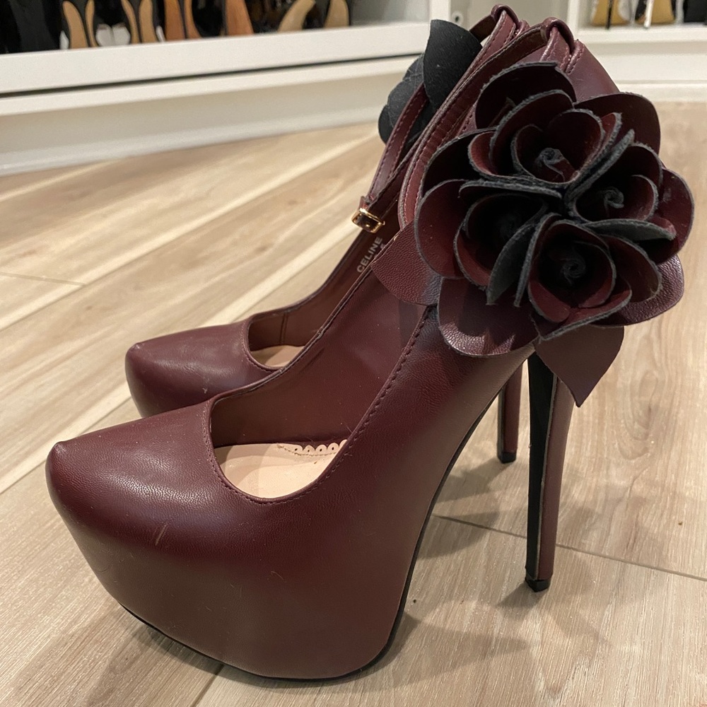 Amazing sky high platform heels with ankle straps and beautiful side flowers.
